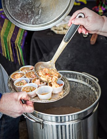 Gallery 2 - person scooping gumbo into small cups