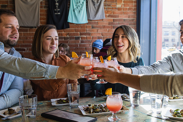 Gallery 1 - Friends toasting on a food tour in Colorado Springs