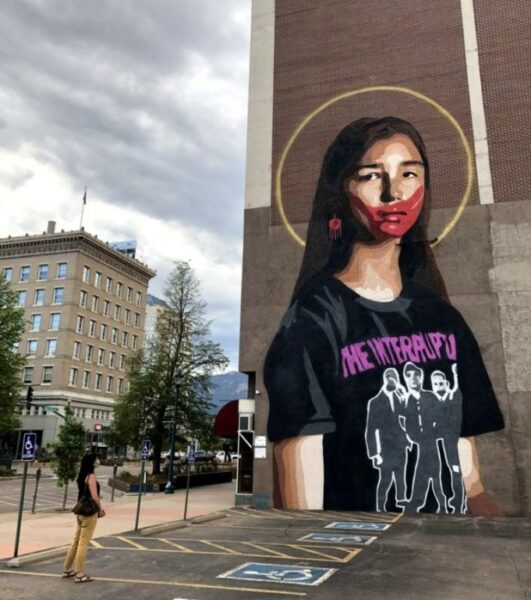 mural of a young native girl in a band t shirt